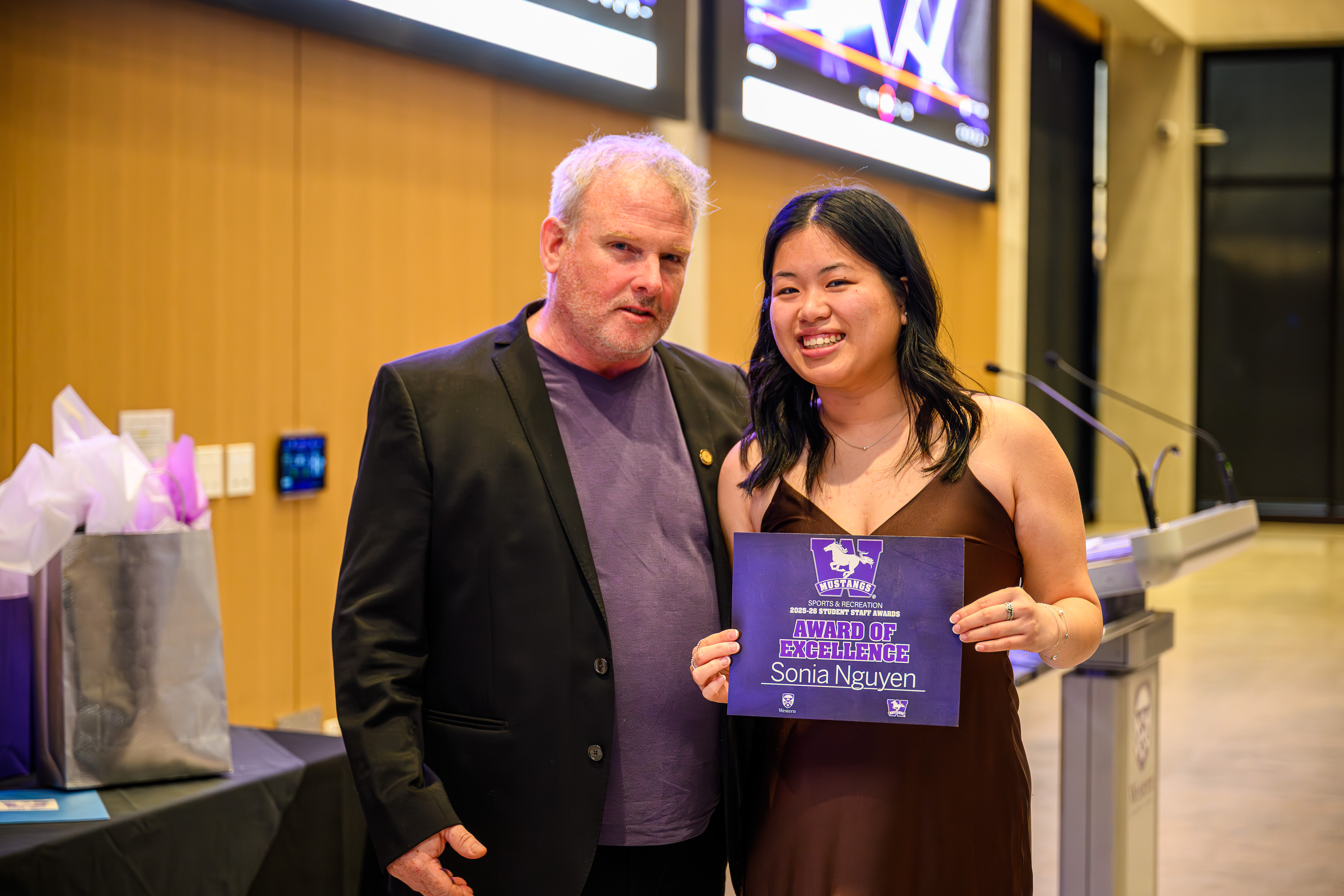 Photo of major award winner and presenter with certificate